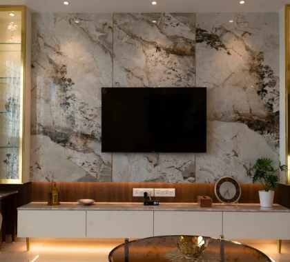 TV Unit with Marble Backdrop and Backlit Glass Displays